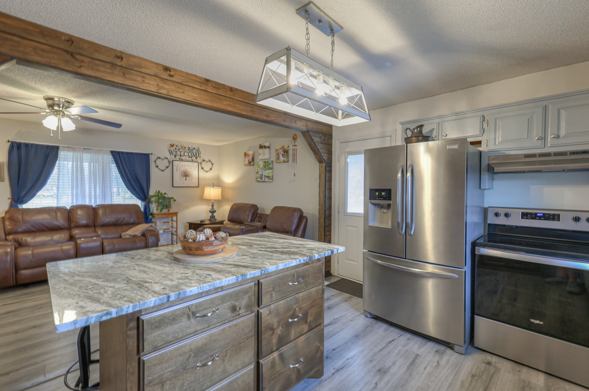 636 Warner Bridge Road Shelbyville, TN 37160 - Photo 14 of 32 a kitchen with kitchen island granite countertop a sink appliances a dining table and chairs