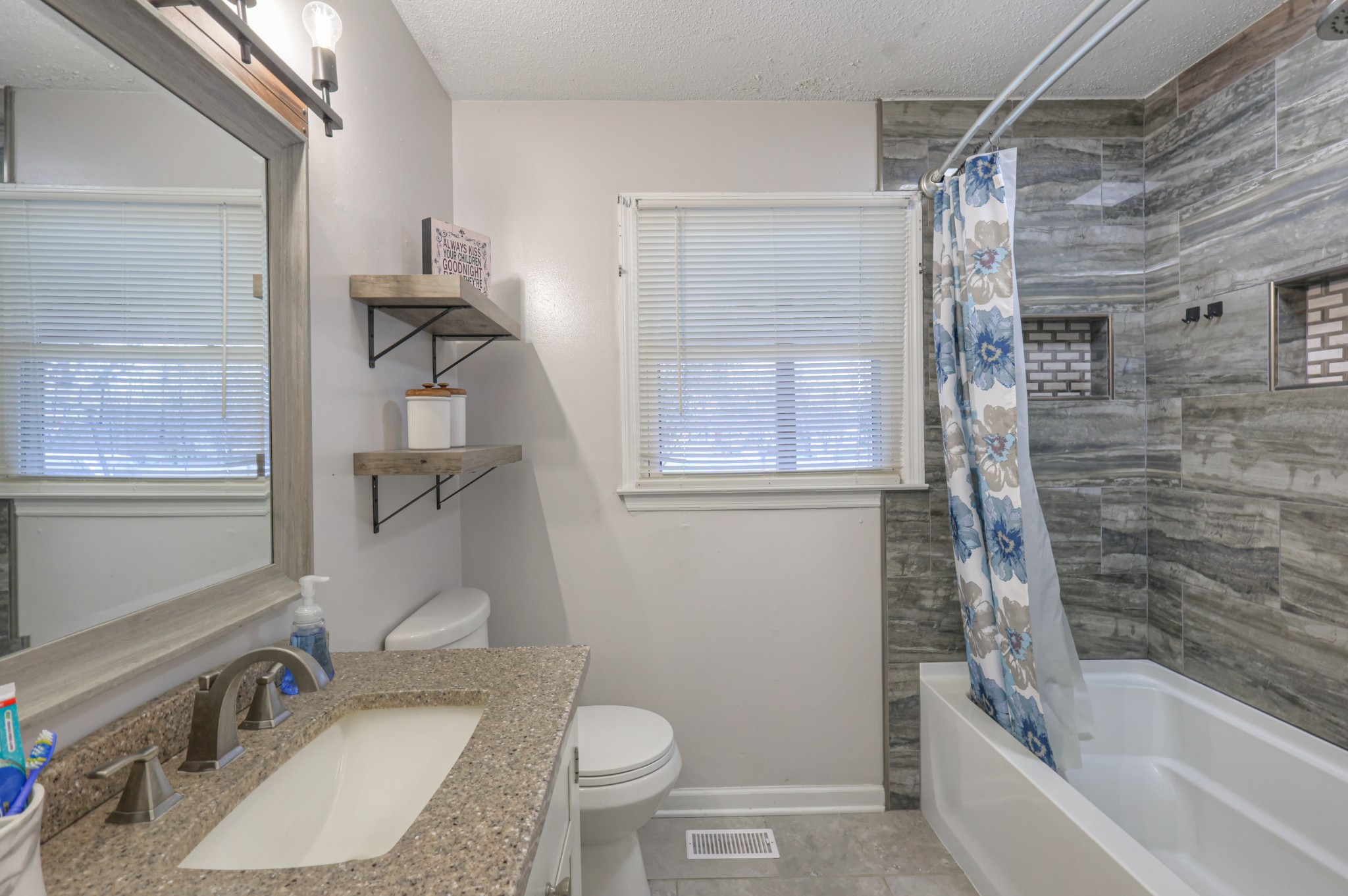 636 Warner Bridge Road Shelbyville, TN 37160 - Photo 15 of 32 a bathroom with a sink toilet and shower