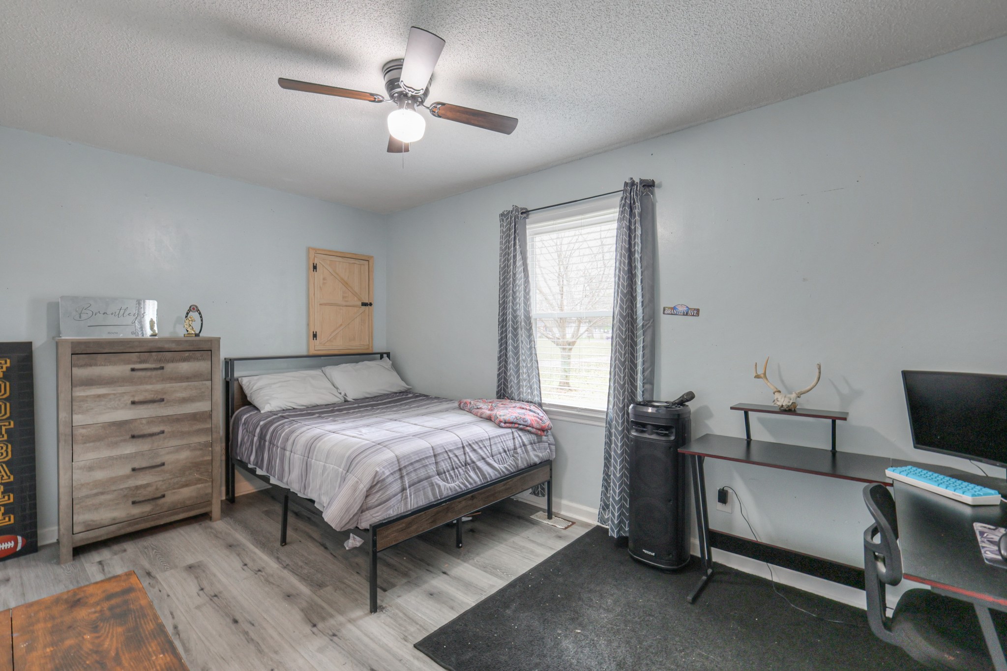 636 Warner Bridge Road Shelbyville, TN 37160 - Photo 17 of 32 a bedroom with a bed and a chandelier