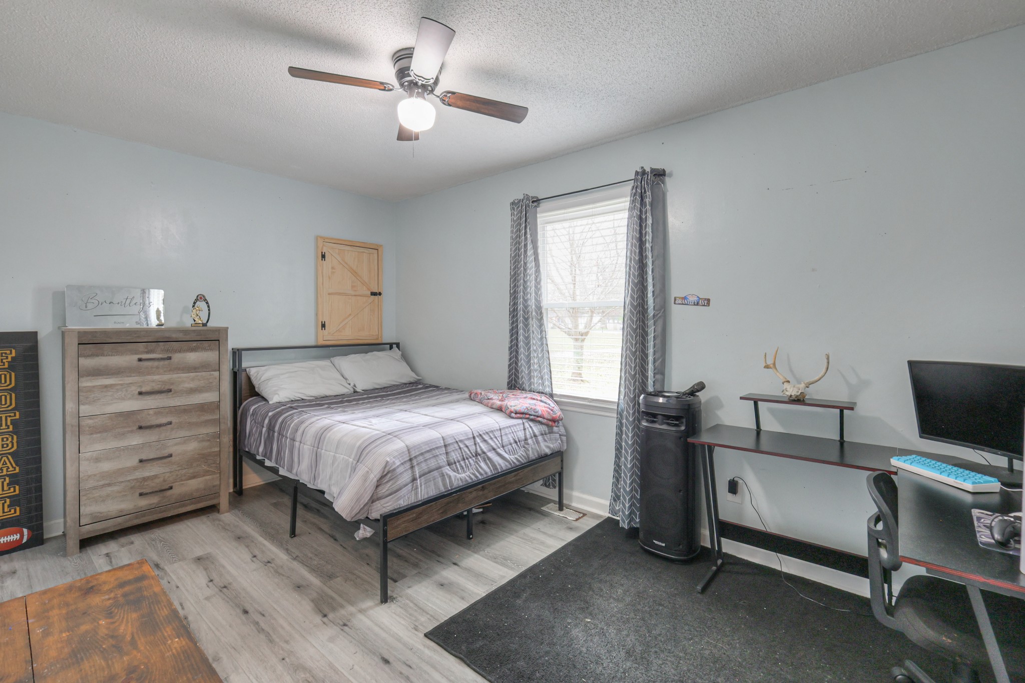 636 Warner Bridge Road Shelbyville, TN 37160 - Photo 18 of 32 a bedroom with a bed and a chandelier