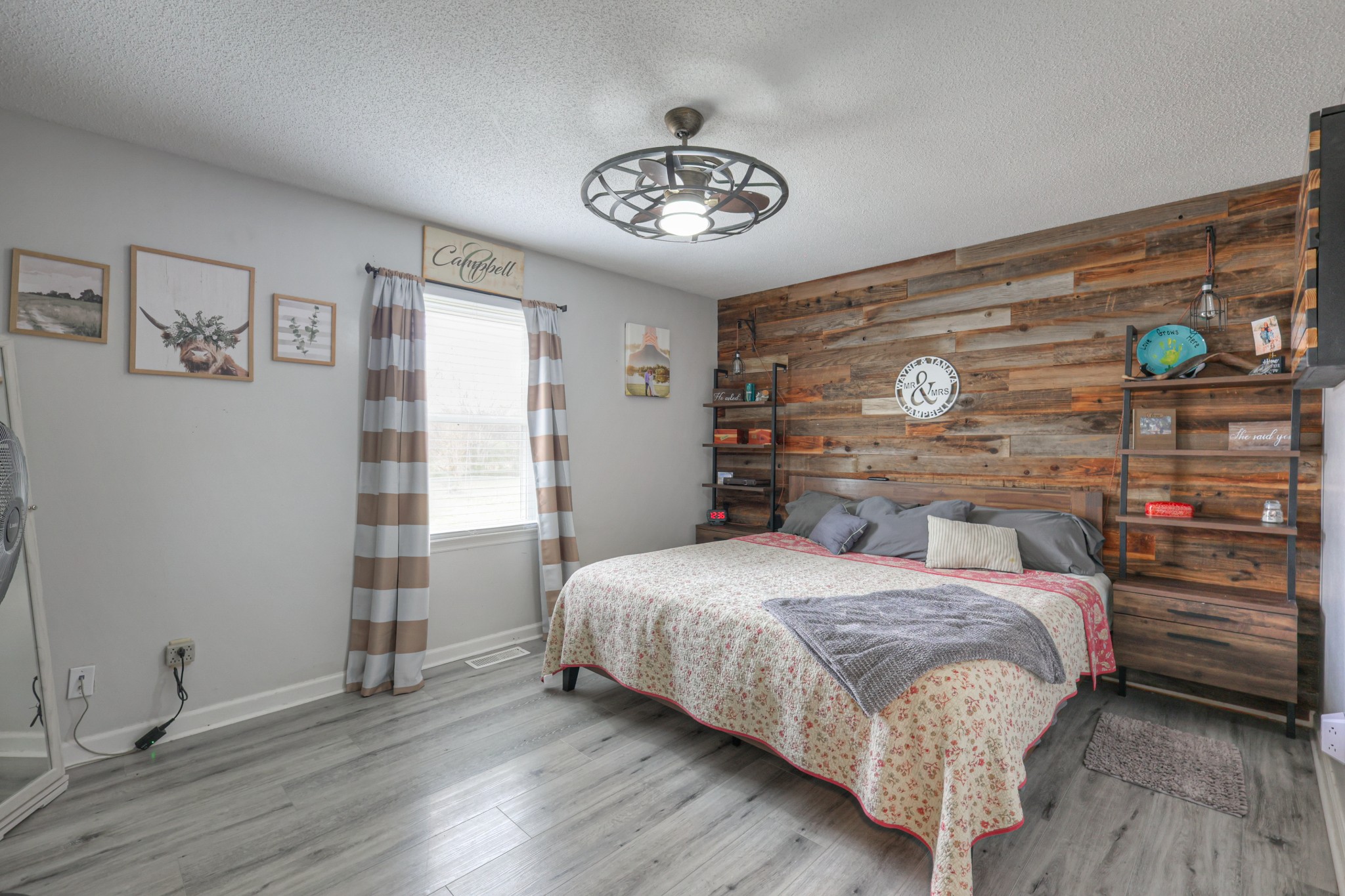 636 Warner Bridge Road Shelbyville, TN 37160 - Photo 20 of 32 a bedroom with a bed and a chandelier