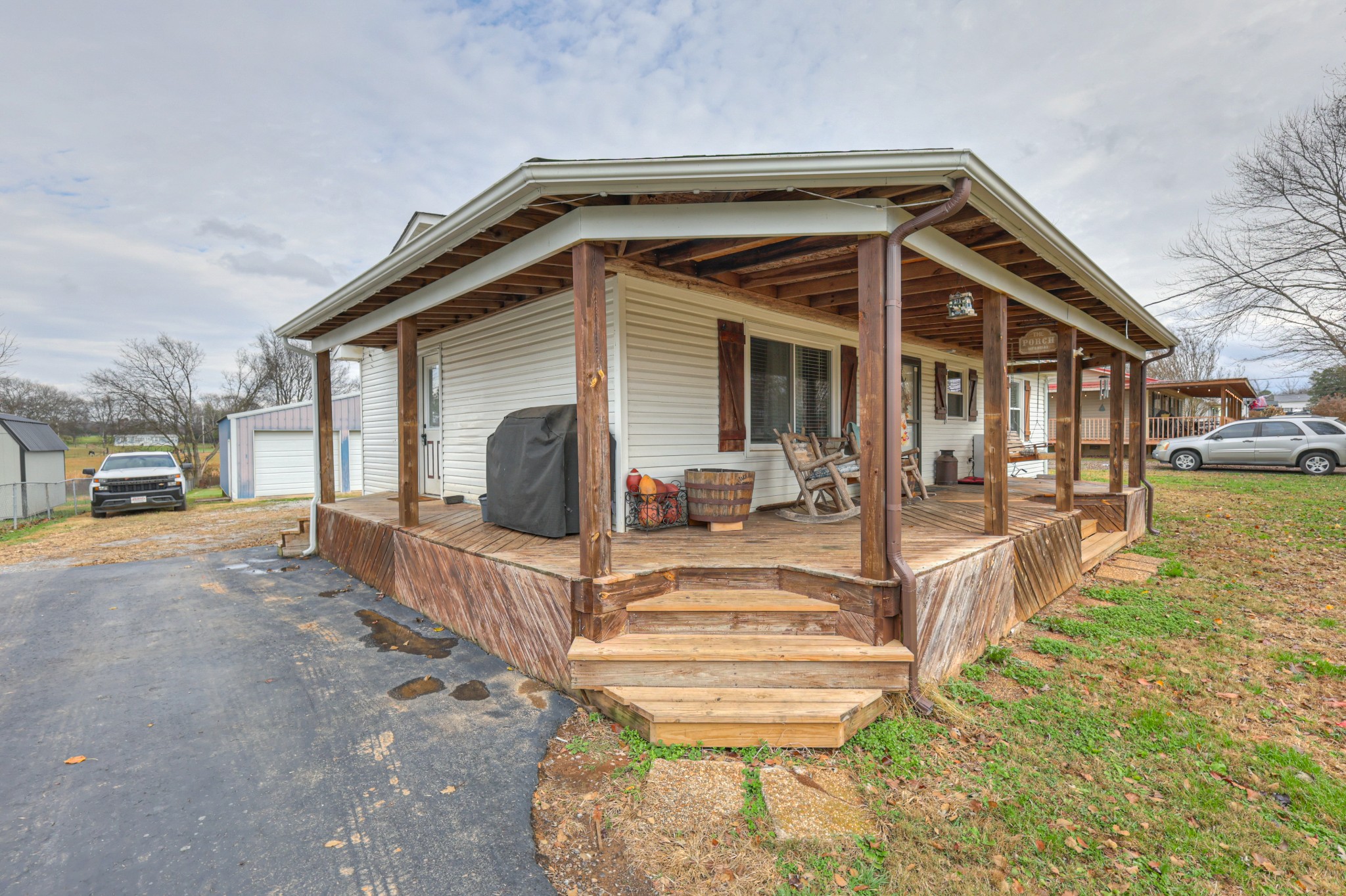 636 Warner Bridge Road Shelbyville, TN 37160 - Photo 2 of 32 a view of a house with backyard porch and sitting area