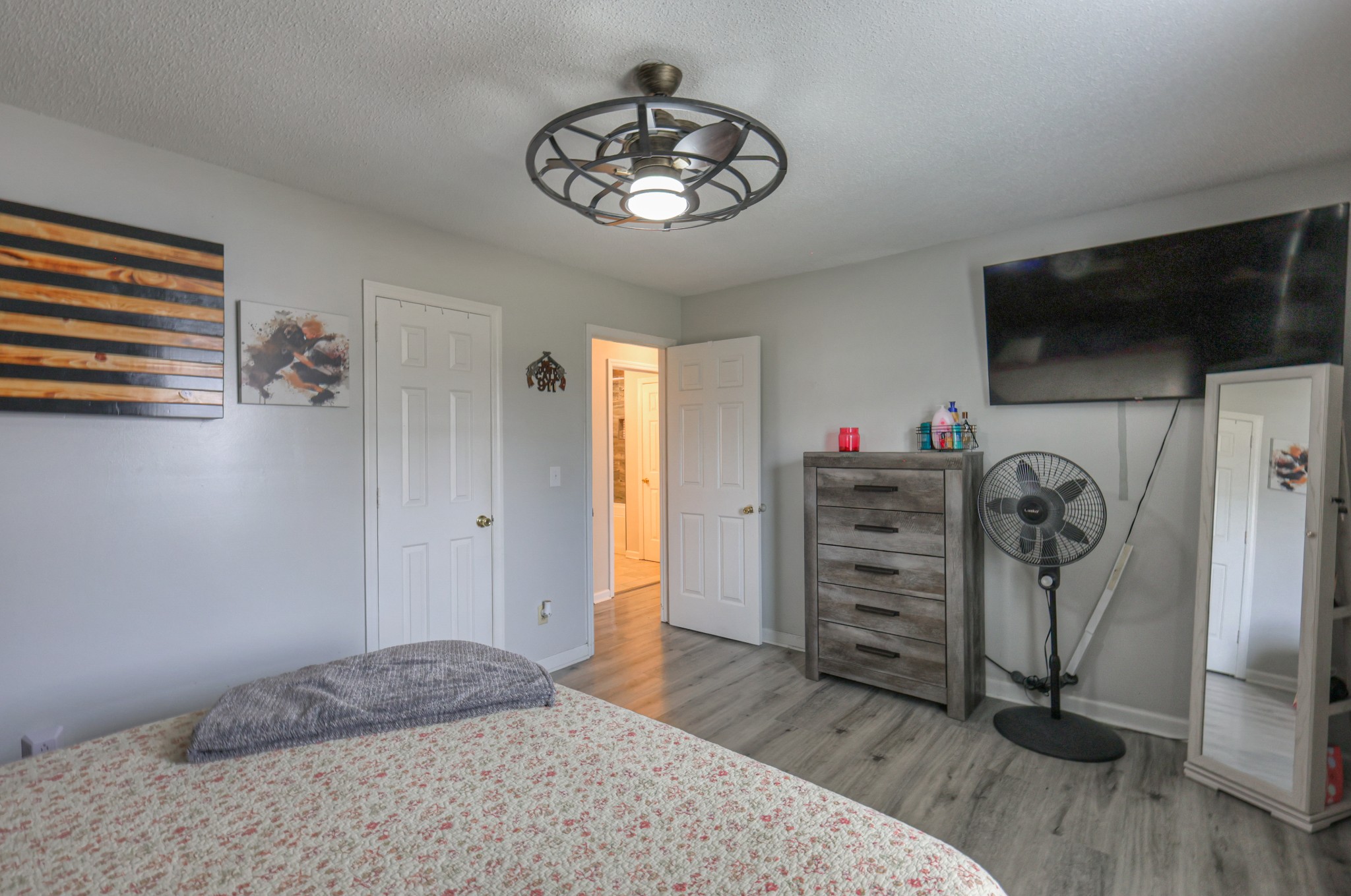 636 Warner Bridge Road Shelbyville, TN 37160 - Photo 21 of 32 a bedroom with a bed and a flat screen tv