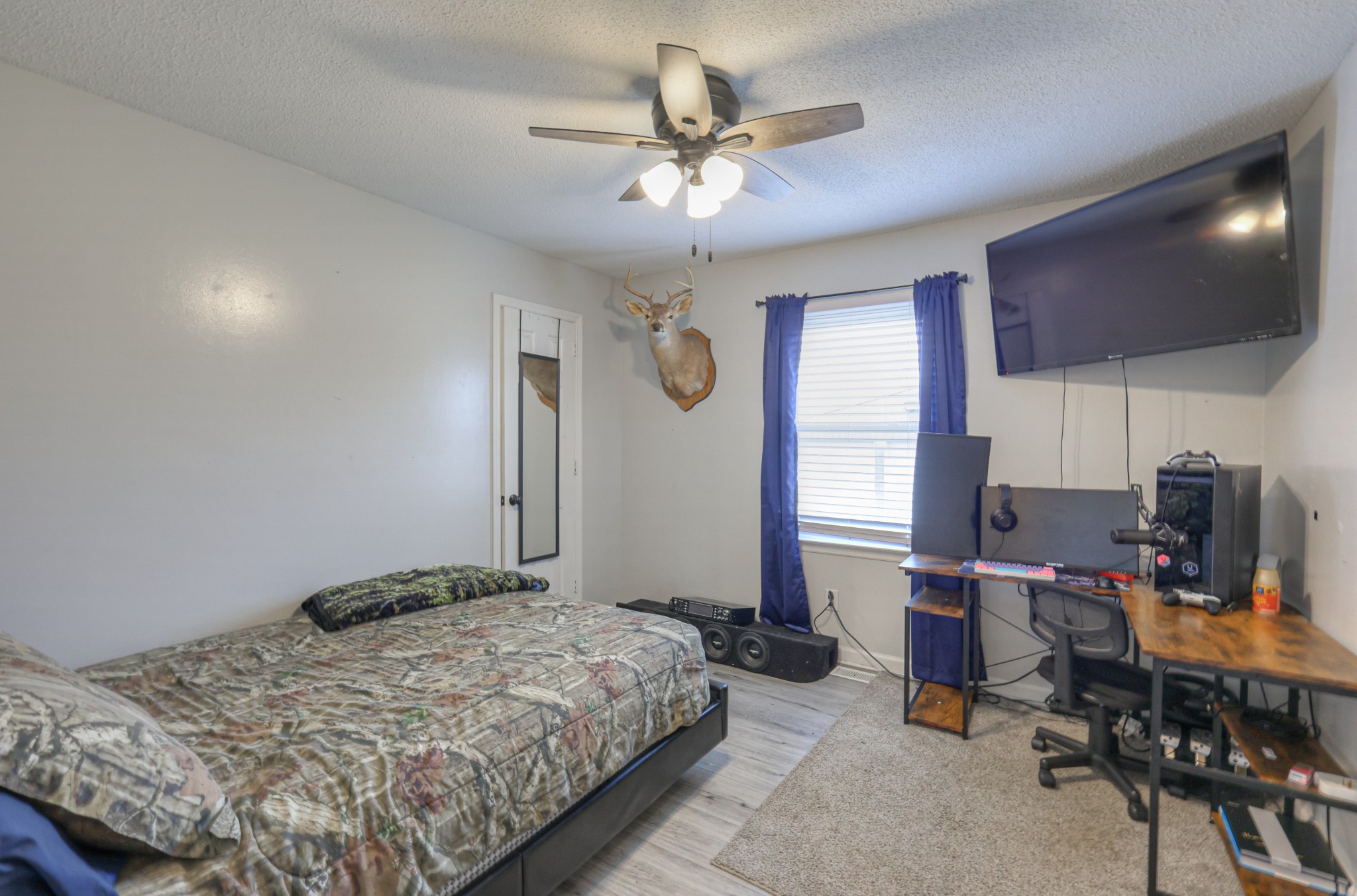 636 Warner Bridge Road Shelbyville, TN 37160 - Photo 22 of 32 a bedroom with a bed work place and a desk