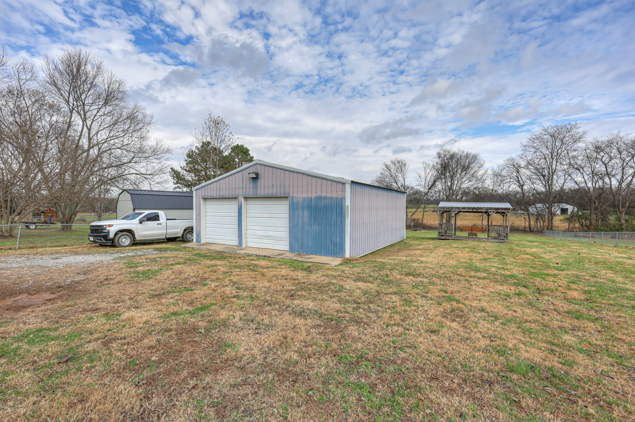 636 Warner Bridge Road Shelbyville, TN 37160 - Photo 26 of 32 a house with trees in front of it
