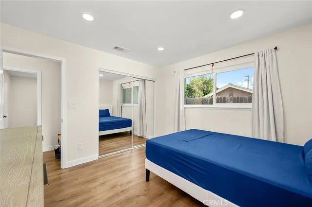 a bedroom with furniture and window