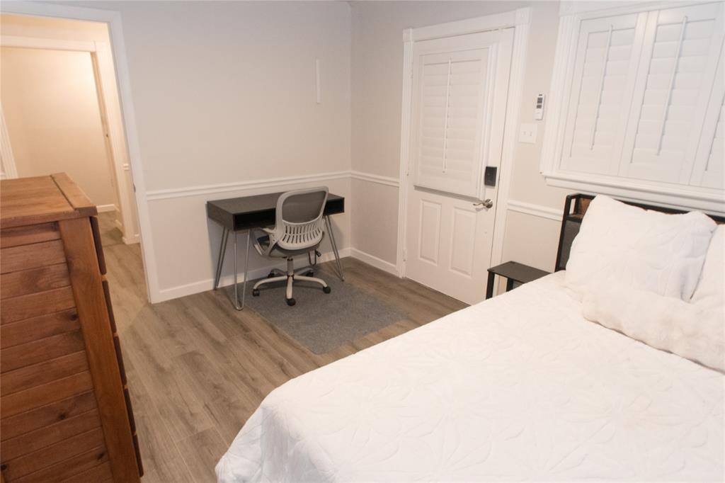 2129 Province Lane Dallas, TX 75228 - Photo 5 of 33 a bedroom with a bed and a chair