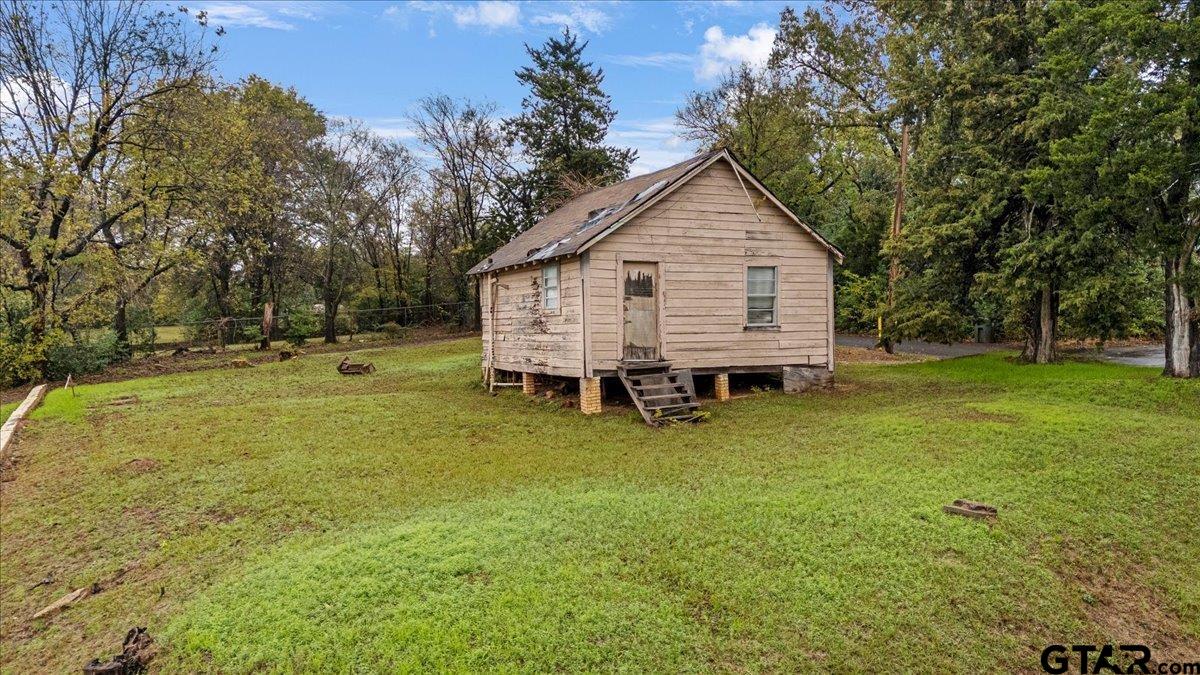 441 South Ross Avenue Tyler, TX 75702 - Photo 5 of 7 a view of a house with backyard and trees