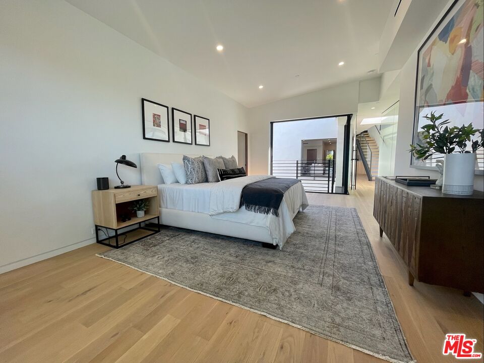 700 Brooks Avenue Venice, CA 90291 - Photo 11 of 31 a living room with furniture and a flat screen tv