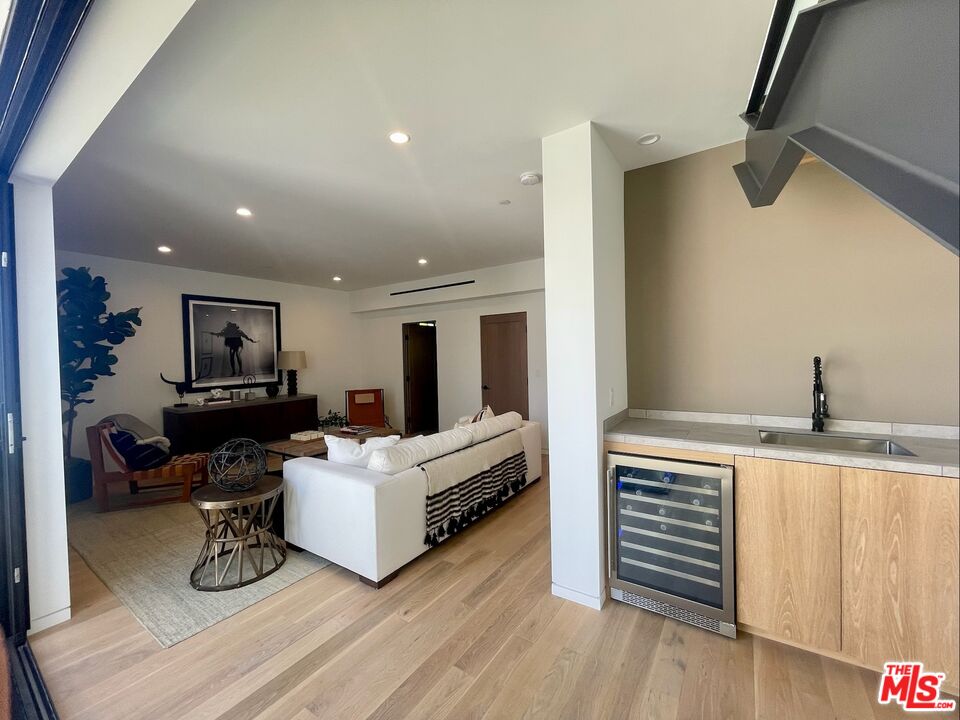700 Brooks Avenue Venice, CA 90291 - Photo 19 of 31 a living room with furniture and a wooden floor
