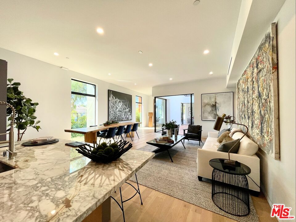 700 Brooks Avenue Venice, CA 90291 - Photo 7 of 31 a living room with furniture and a large window