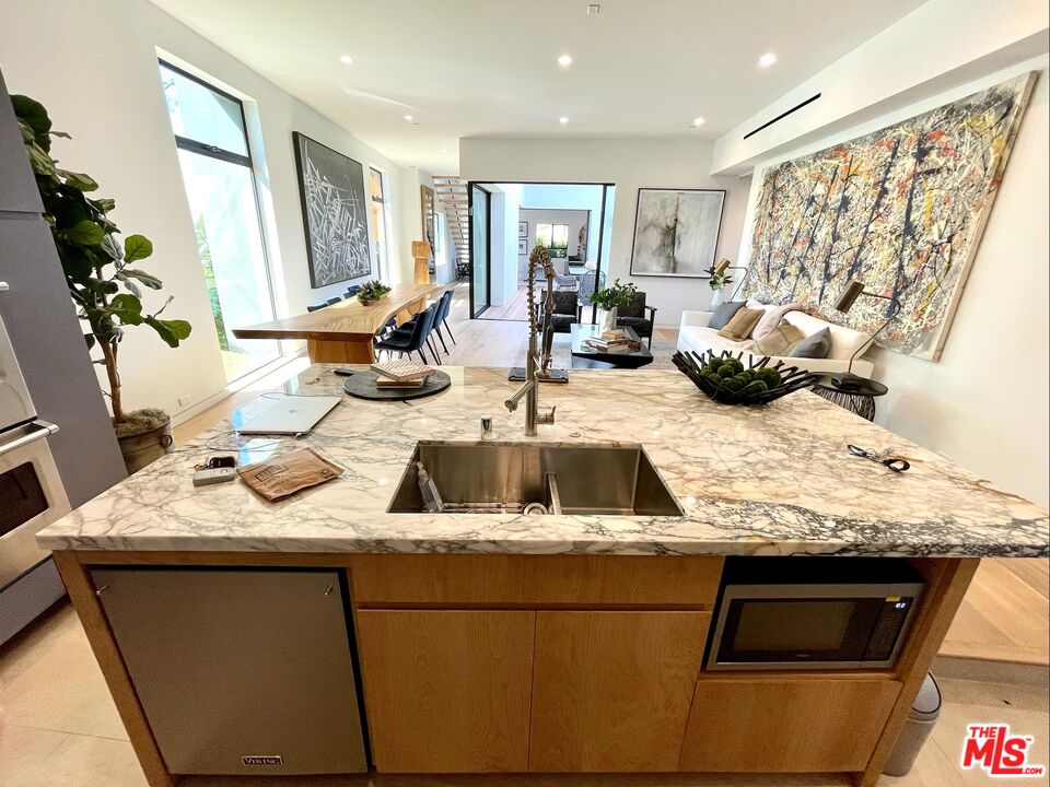700 Brooks Avenue Venice, CA 90291 - Photo 9 of 31 a kitchen with a sink stove and cabinets