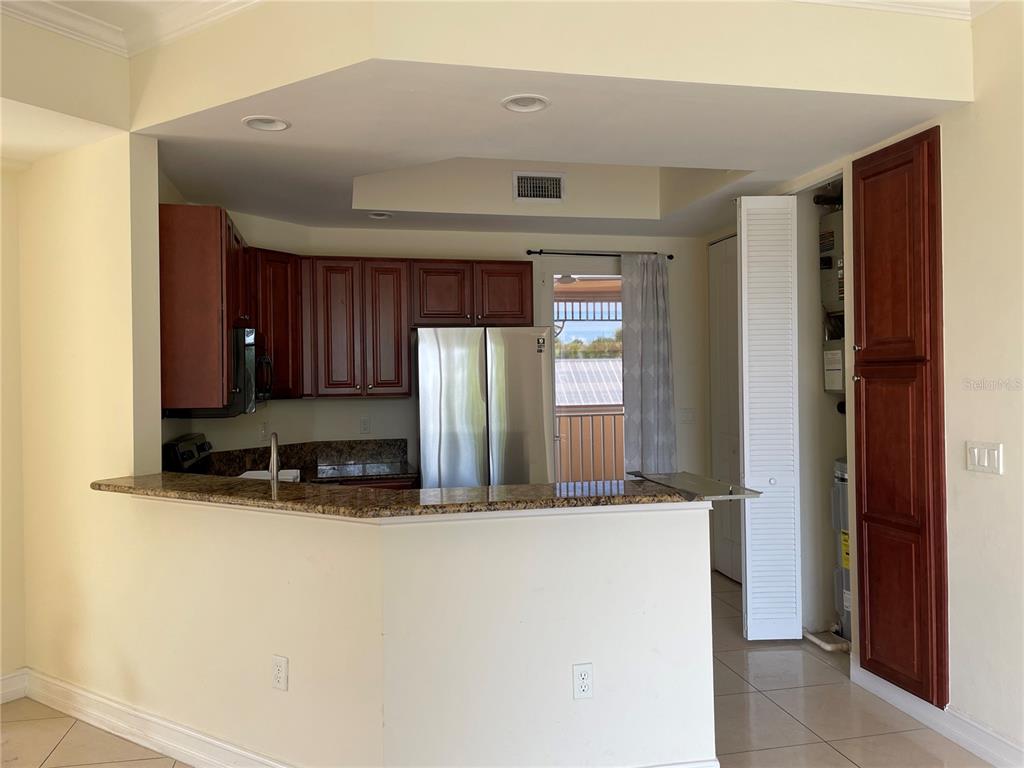 4400-4420 Bonita Beach Walk Drive, Unit MULTI Bonita Springs, FL 34134 - Photo 17 of 67 a view of kitchen with refrigerator and window