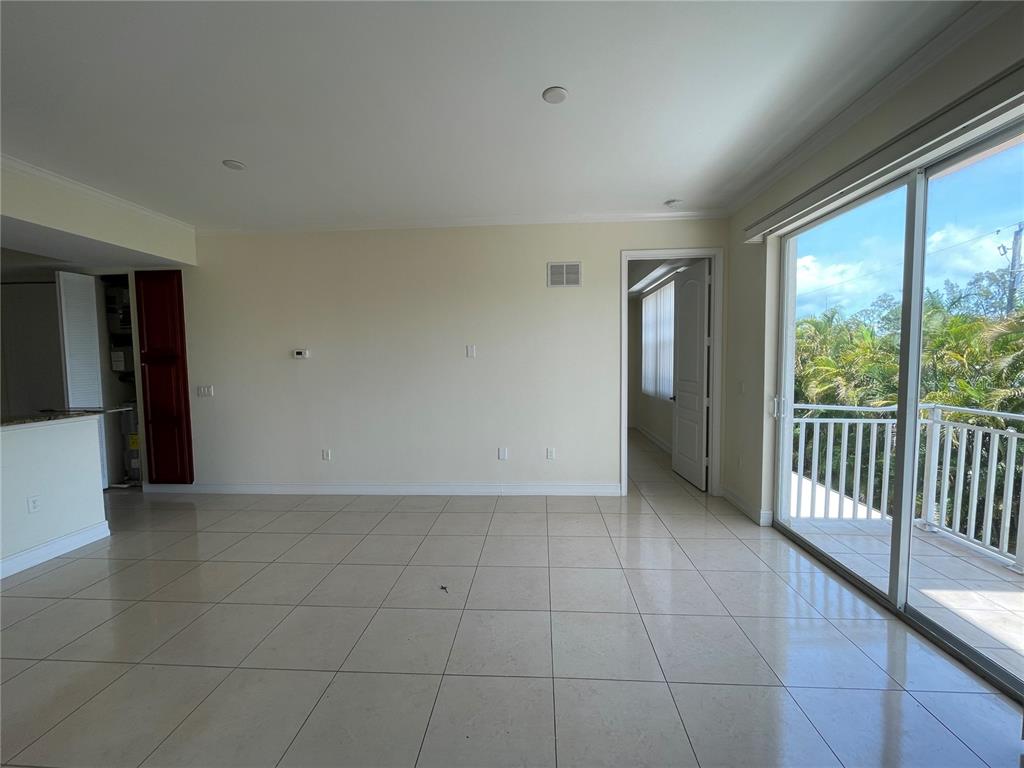4400-4420 Bonita Beach Walk Drive, Unit MULTI Bonita Springs, FL 34134 - Photo 21 of 67 a view of a livingroom with an empty space and glass door