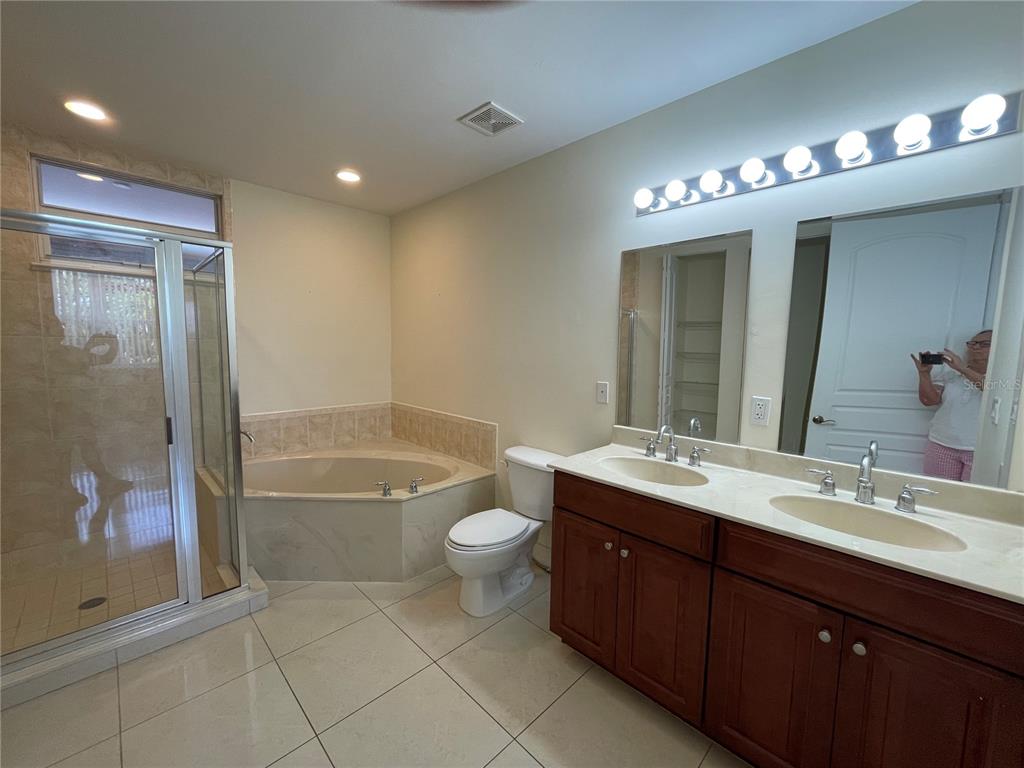 4400-4420 Bonita Beach Walk Drive, Unit MULTI Bonita Springs, FL 34134 - Photo 25 of 67 a bathroom with a sink double vanity granite tub and a mirror