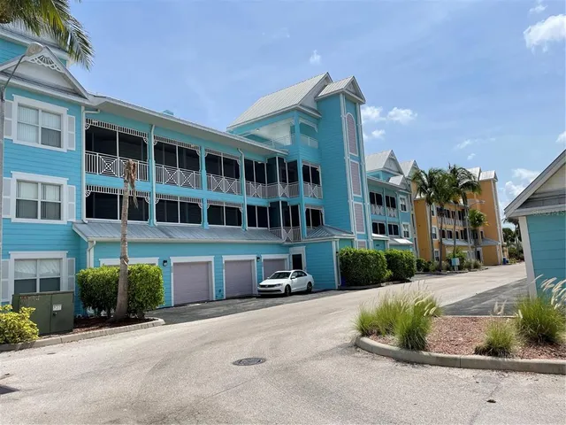 a large bed sitting in a bedroom next to a window