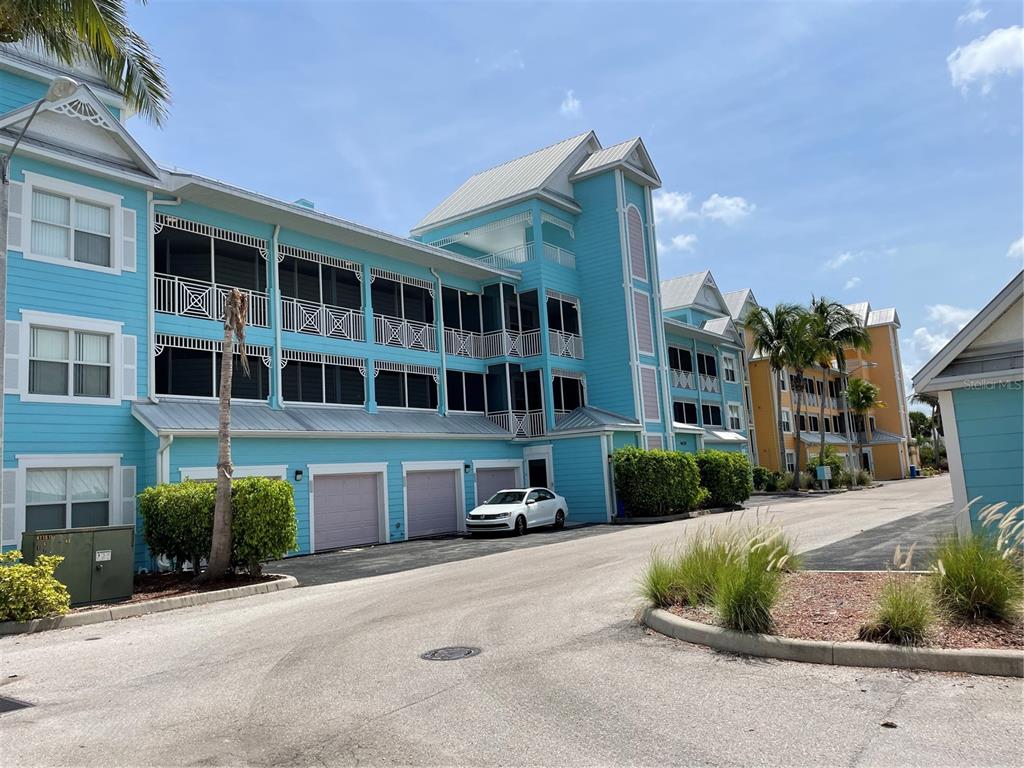4400-4420 Bonita Beach Walk Drive, Unit MULTI Bonita Springs, FL 34134 - Photo 33 of 67 a front view of a house with a yard