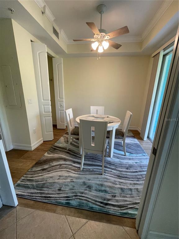 4400-4420 Bonita Beach Walk Drive, Unit MULTI Bonita Springs, FL 34134 - Photo 39 of 67 a view of a dining room with furniture and wooden floor