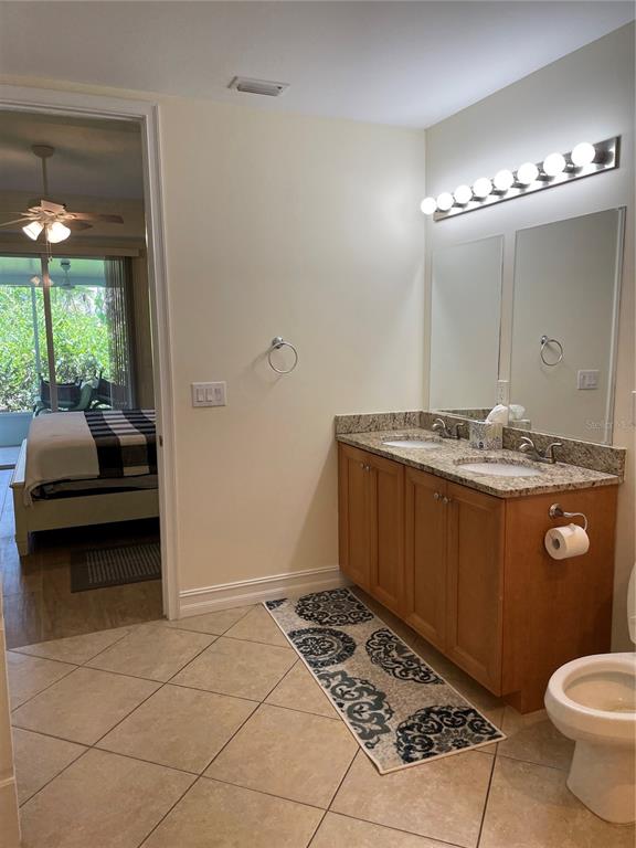 4400-4420 Bonita Beach Walk Drive, Unit MULTI Bonita Springs, FL 34134 - Photo 45 of 67 a bathroom with a granite countertop sink and a mirror