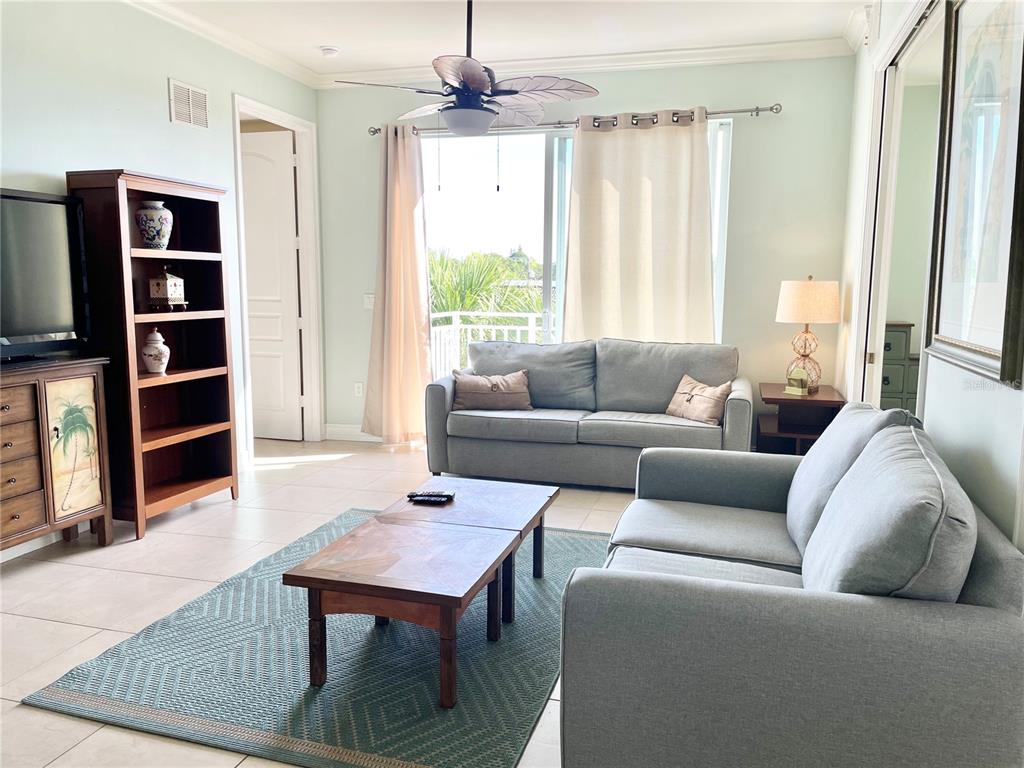 4400-4420 Bonita Beach Walk Drive, Unit MULTI Bonita Springs, FL 34134 - Photo 66 of 67 a living room with furniture and a window