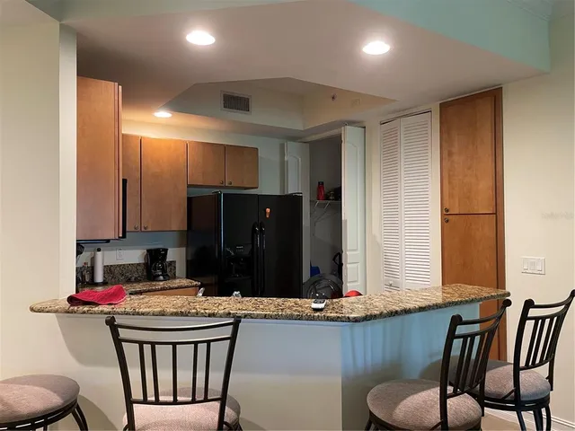 a bathroom with a double vanity sink mirror and toilet