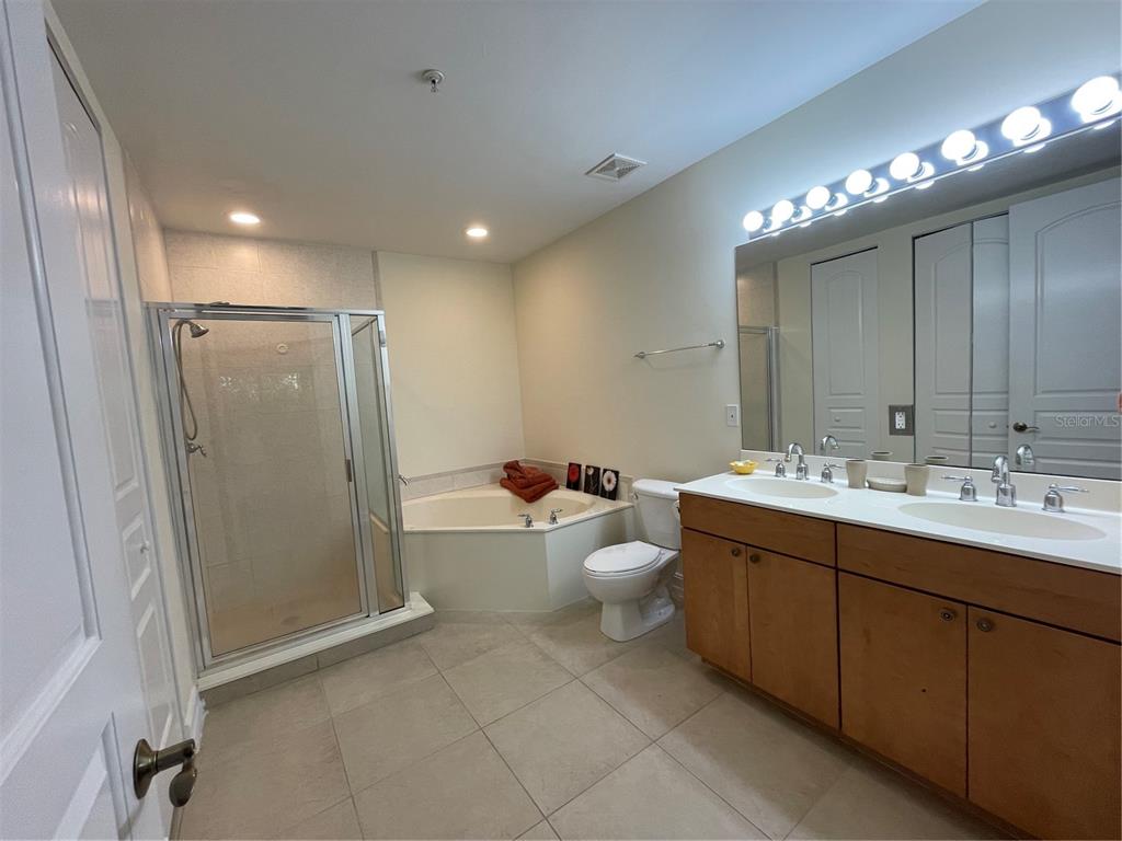 4400-4420 Bonita Beach Walk Drive, Unit MULTI Bonita Springs, FL 34134 - Photo 10 of 67 a bathroom with a double vanity sink mirror and toilet