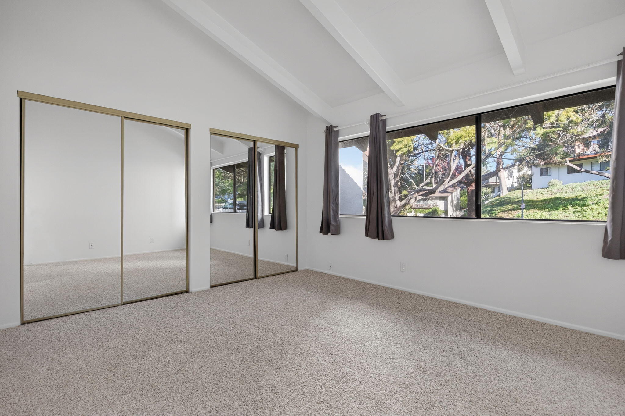 969 Miramonte Drive, Unit 5 Santa Barbara, CA 93109 - Photo 12 of 27 an empty room with windows