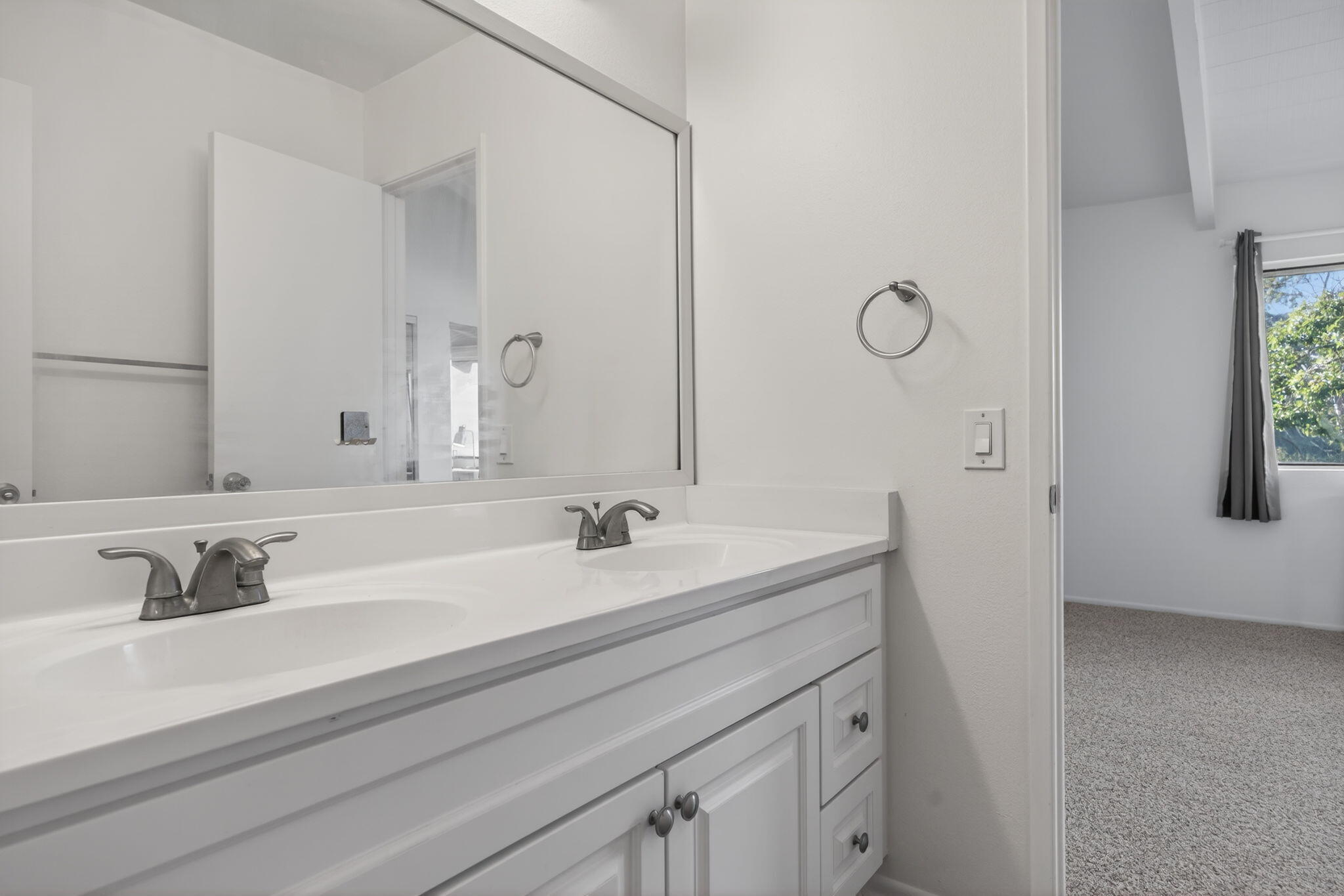 969 Miramonte Drive, Unit 5 Santa Barbara, CA 93109 - Photo 15 of 27 a bathroom with a sink and a mirror