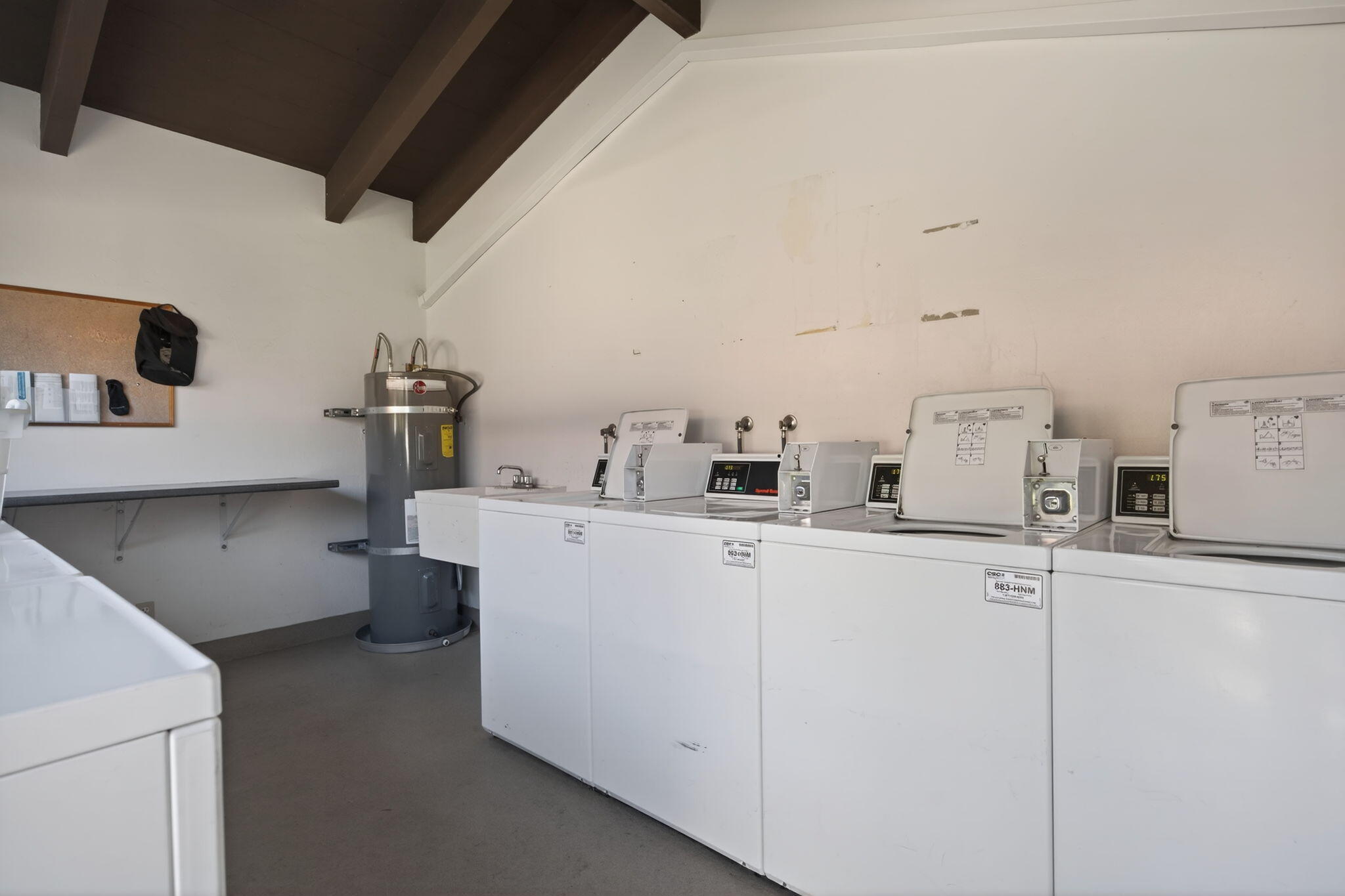 969 Miramonte Drive, Unit 5 Santa Barbara, CA 93109 - Photo 24 of 27 a utility room with dryer and washer