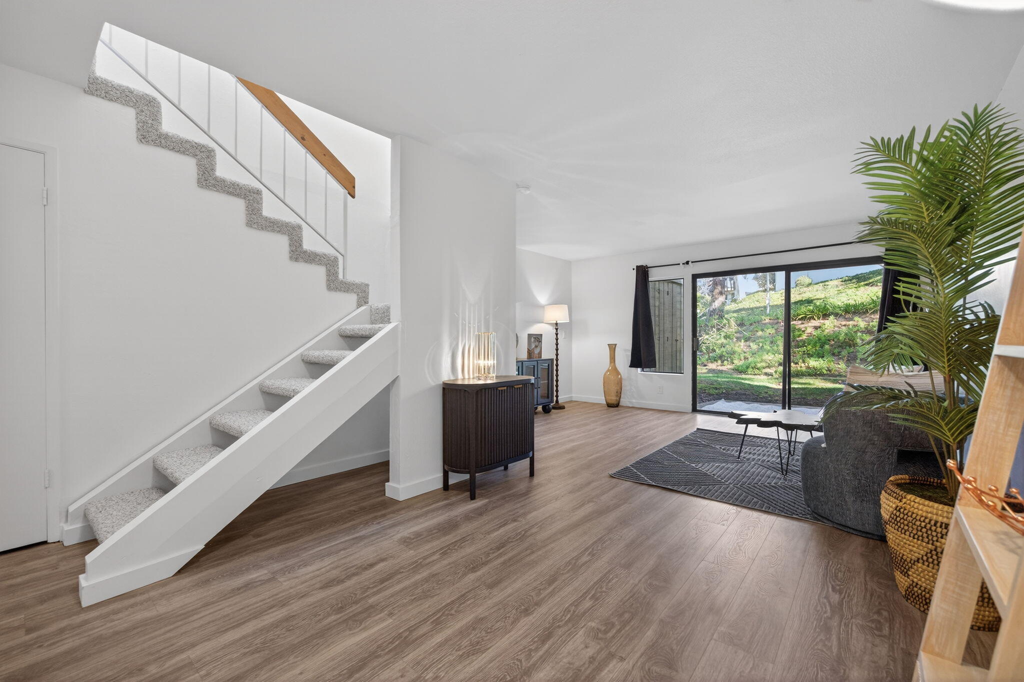 969 Miramonte Drive, Unit 5 Santa Barbara, CA 93109 - Photo 3 of 27 a living room with furniture and a large window