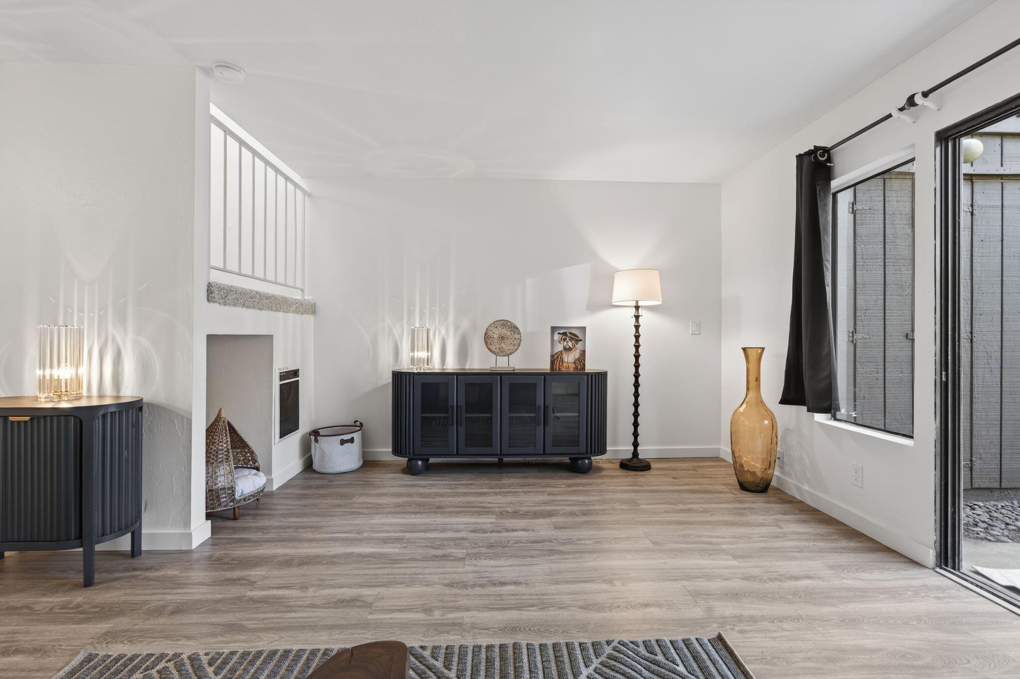 969 Miramonte Drive, Unit 5 Santa Barbara, CA 93109 - Photo 9 of 27 a living room with furniture a flat screen tv and a fireplace