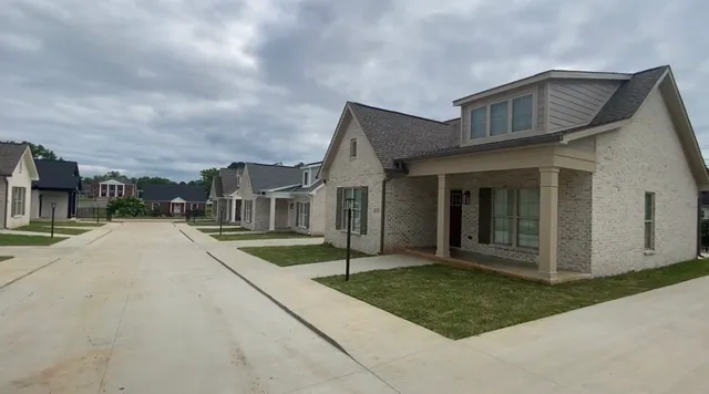 a view of house with yard