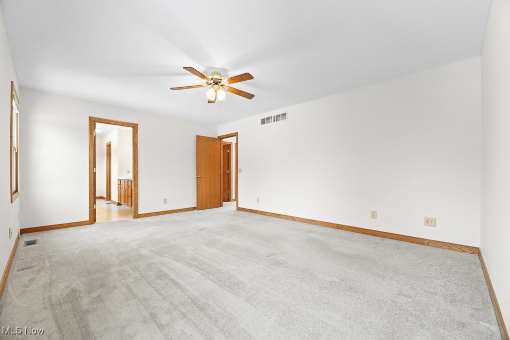 4808 Sherman Road Kent, OH 44240 - Photo 38 of 50 Unfurnished bedroom with light carpet, a ceiling fan, and ensuite bathroom