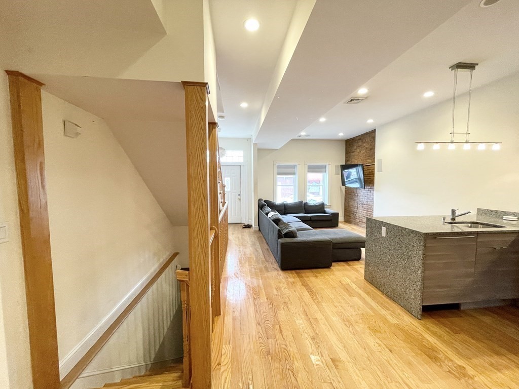 98 L Street, Unit STREET Boston, MA 02127 - Photo 3 of 19 a living room with furniture and a large window