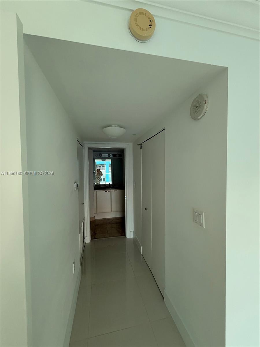 2101 Brickell Avenue, Unit 1504 Miami, FL 33129 - Photo 12 of 15 a view of a hallway to a bedroom