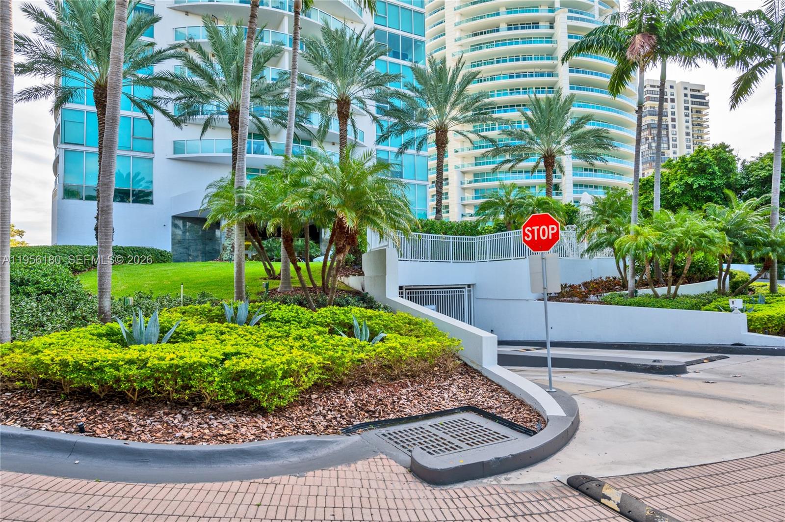 2101 Brickell Avenue, Unit 1504 Miami, FL 33129 - Photo 3 of 15 a front view of a house with a yard and potted plants