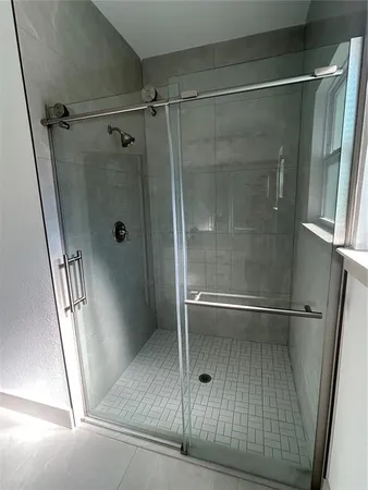 a bathroom with a double vanity sink and mirror