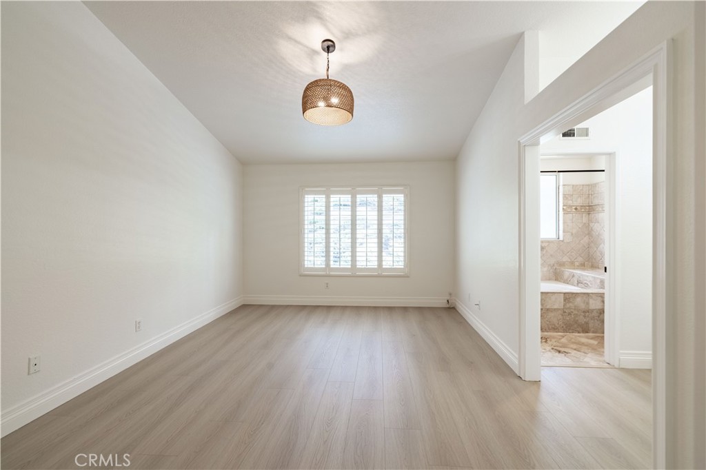 8 Massier Lane Lake Forest, CA 92610 - Photo 11 of 34 an empty room with wooden floor and windows
