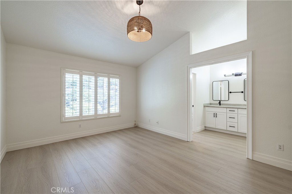 8 Massier Lane Lake Forest, CA 92610 - Photo 12 of 34 wooden floor in an empty room with a window