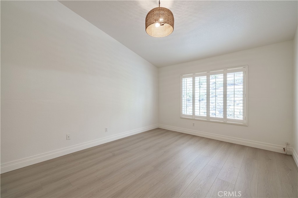 8 Massier Lane Lake Forest, CA 92610 - Photo 15 of 34 an empty room with wooden floor and windows