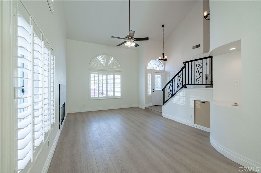 8 Massier Lane Lake Forest, CA 92610 - Photo 2 of 34 a view of empty room with wooden floor and fan