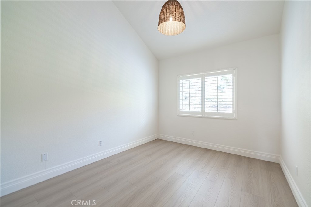 8 Massier Lane Lake Forest, CA 92610 - Photo 25 of 34 an empty room with wooden floor and windows