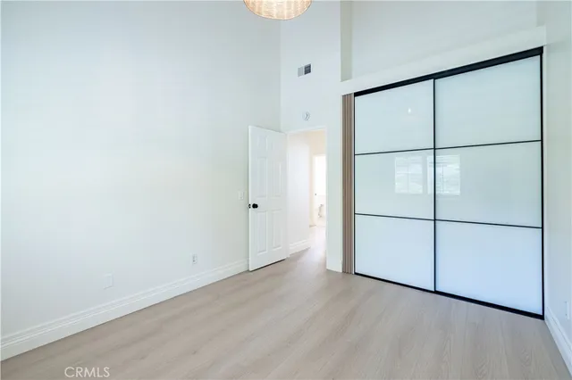an empty room with wooden floor