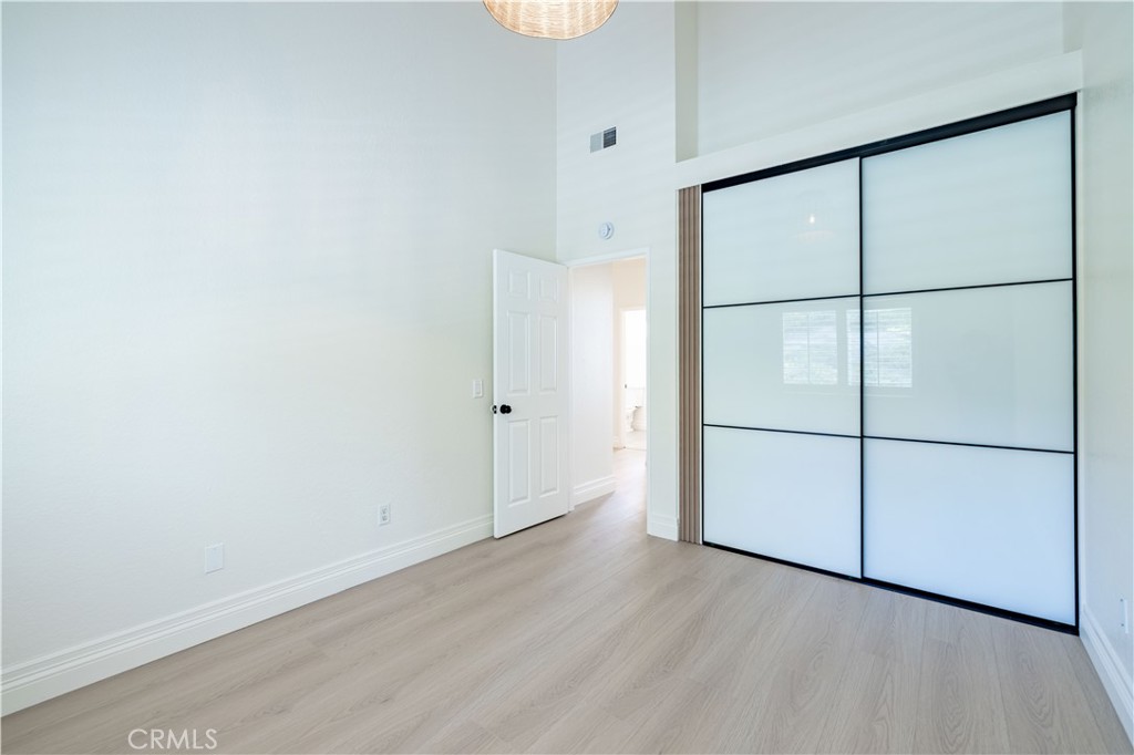 8 Massier Lane Lake Forest, CA 92610 - Photo 26 of 34 an empty room with wooden floor