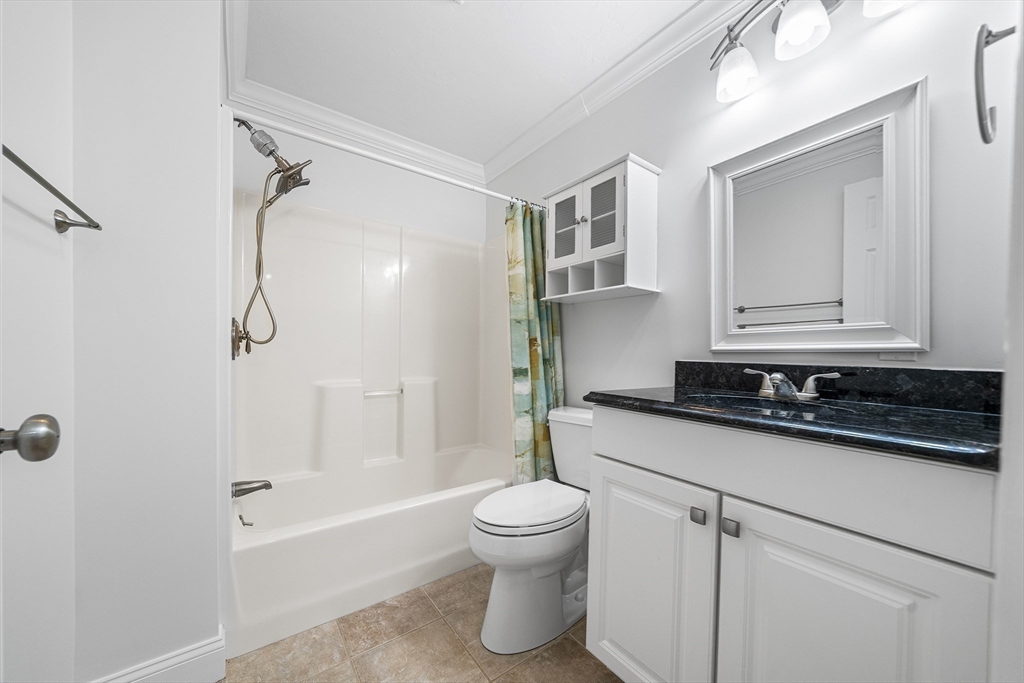 215 Rangeway Road, Unit 31 Billerica, MA 01862 - Photo 27 of 40 a bathroom with a granite countertop sink a toilet and shower