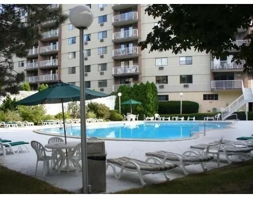 a view of a patio with table and chairs potted plants