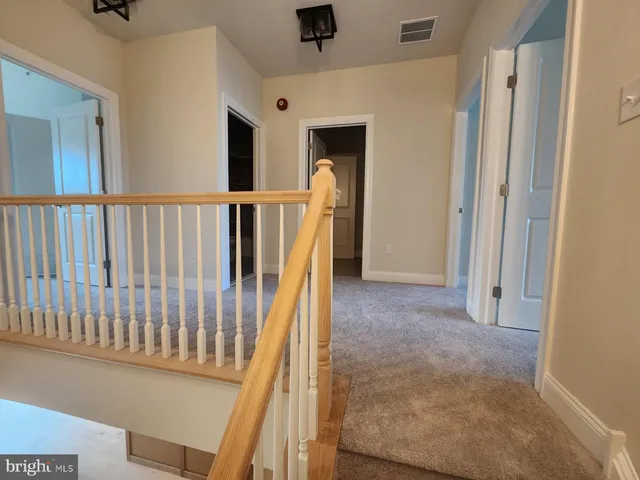 a view of a hallway with windows