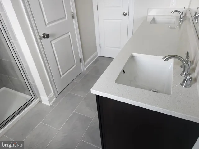 a bathroom with a sink and a tub