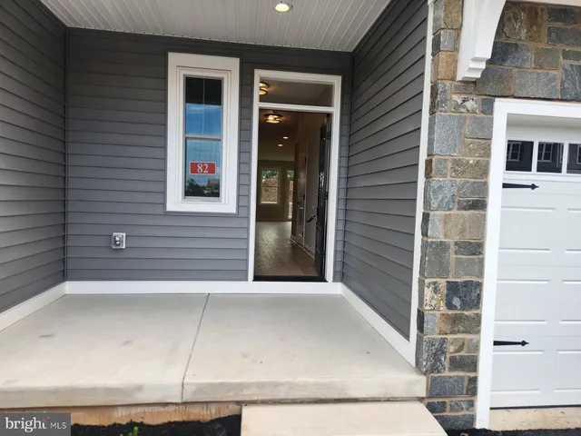 a view of a brick house with windows
