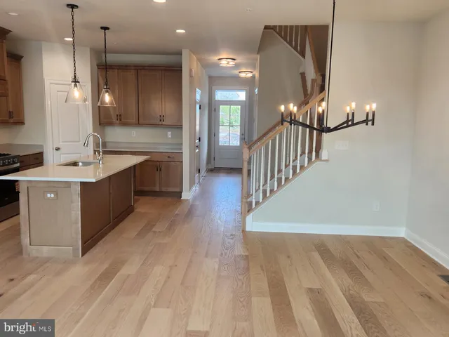 a large kitchen with lots of counter space and a sink